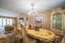 Dining space with a chandelier and vaulted ceiling