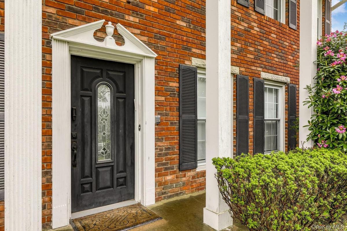 Entrance to property with brick siding