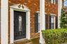 Entrance to property with brick siding