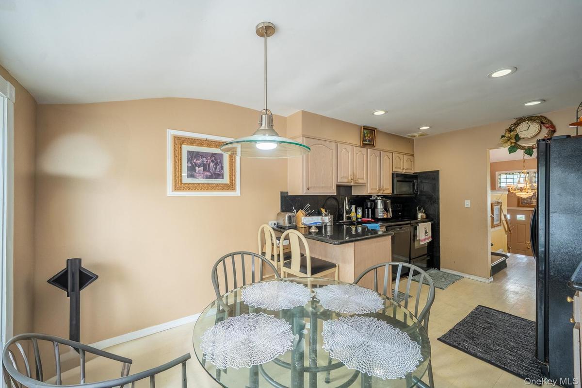 Dining room featuring baseboards and recessed lighting