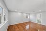 First Floor Primary Bedroom with wood-finish flooring, recessed lighting, and en-suite
