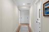 Down the hall find two secondary bedrooms