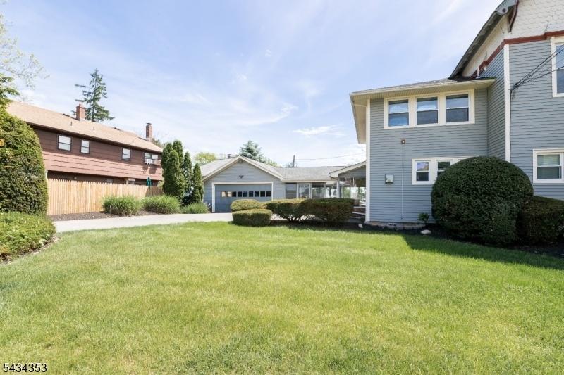 View of garage with driveway