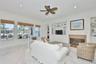 airy family room with built in cabinets and shelving - beadboard accents