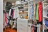 walk in master closet with built-ins