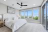 Second Floor Guest Bedroom with Sliders to Balcony and Bay Views
