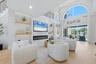Family Room with Feature Wall including Electric Fireplace, Built-in Shelving and Lighting
