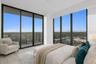 Virtually staged ensuite second bedroom with balcony featuring incredible western and northern views...you may never leave!