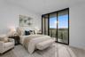 Virtually staged ensuite third bedroom with balcony and southwestern views all the way to St. Pete!