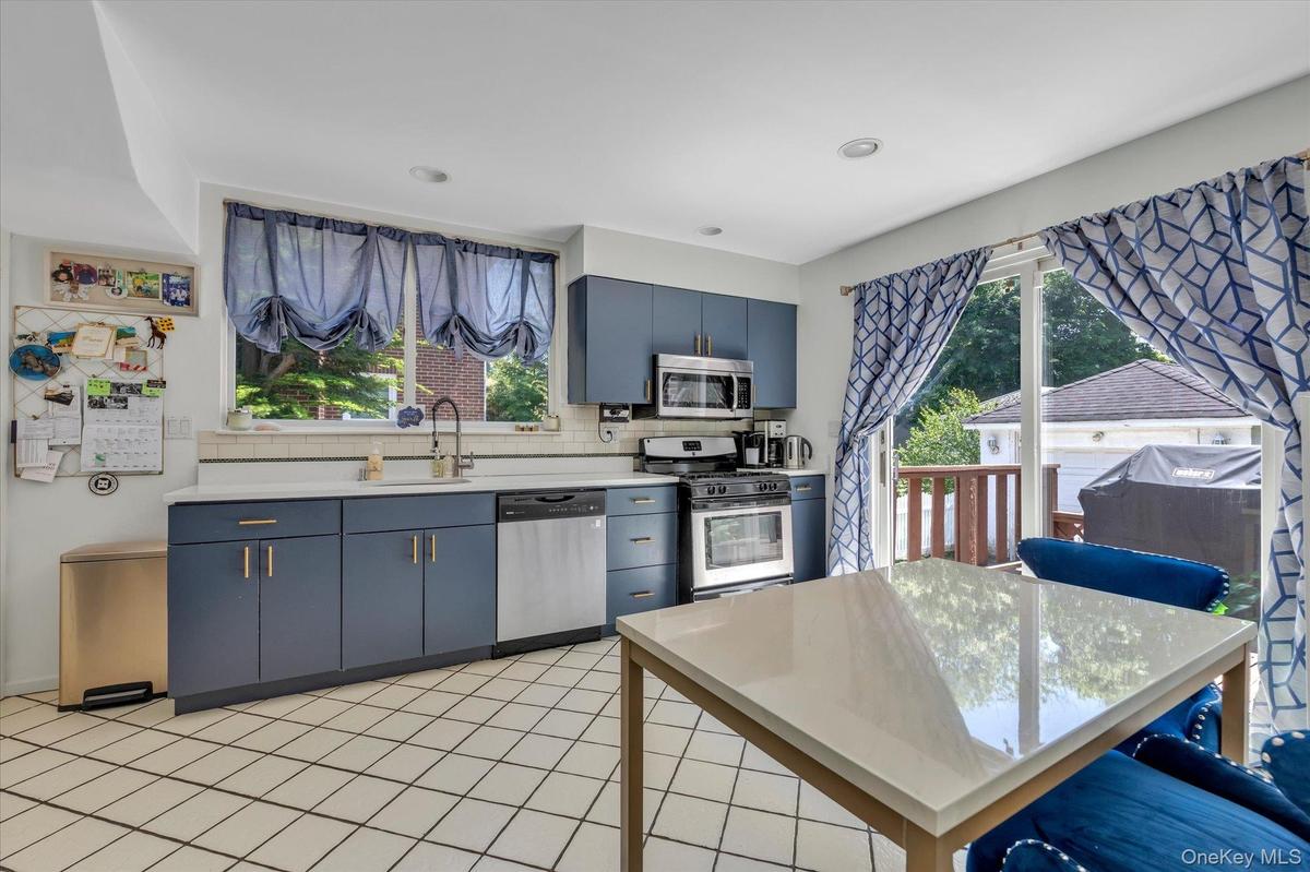 Eat in Kitchen with SS Appliances and Sliders to Deck