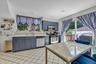 Eat in Kitchen with SS Appliances and Sliders to Deck