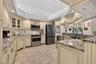 Beautifully updated kitchen with furniture grade cabinetry, granite countertops, stainless appliances, and loads of under cabinet lighting