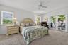 Primary Suite offers access to the back porch via French Doors