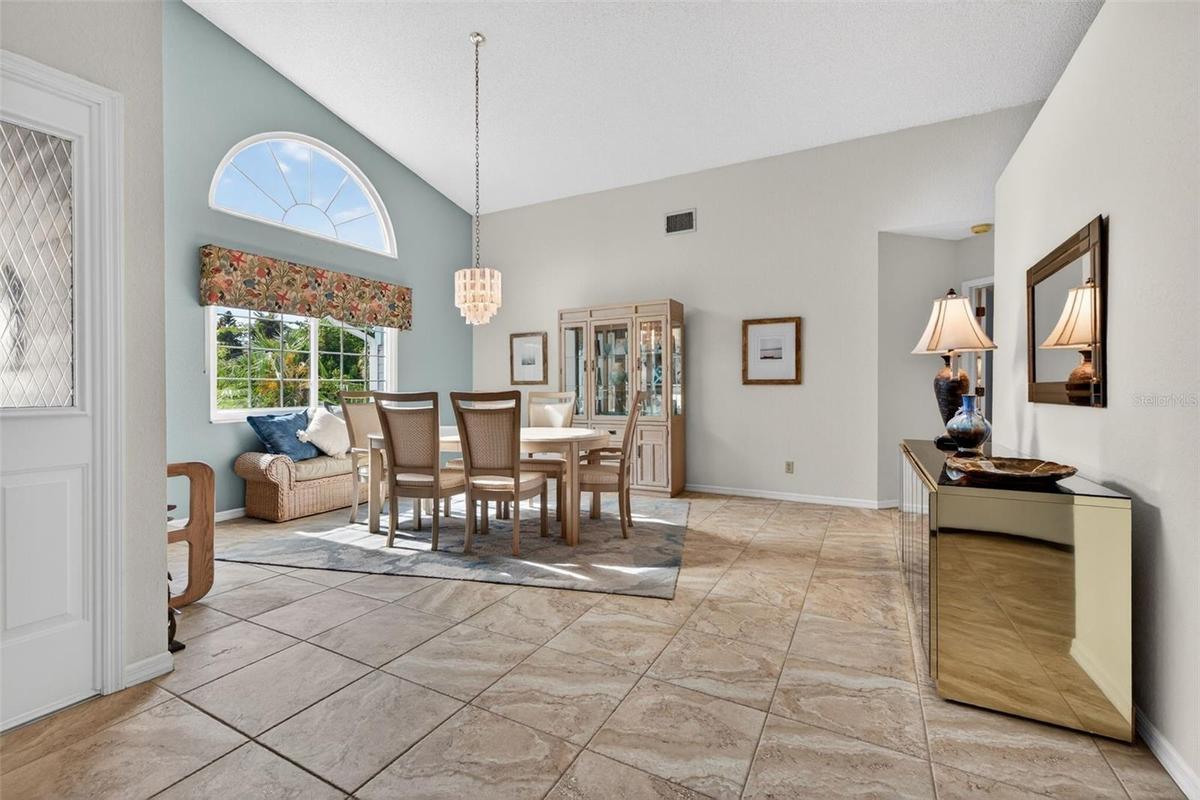 Exceptionally large dining room can accommodate the grandest of gatherings; vaulted ceilings add to the spaciousness