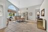 Exceptionally large dining room can accommodate the grandest of gatherings; vaulted ceilings add to the spaciousness