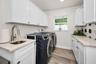 Utility Sink in Laundry Room w/ Folding area & storage Closet