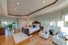 Bedroom featuring recessed lighting, a tray ceiling, and multiple windows