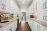 Butlers pantry area between kitchen and diningroom