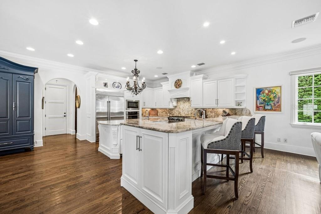 Updated kitchen with ample storage and bar eating area.