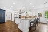 Updated kitchen with ample storage and bar eating area.
