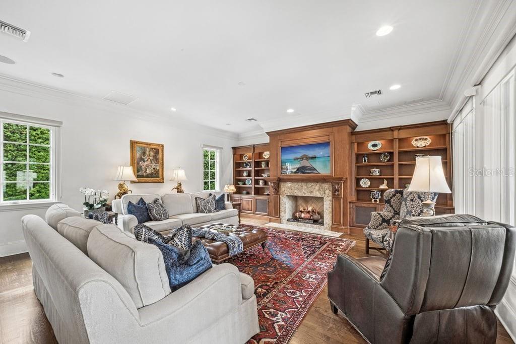 Living room with gas fireplace and custom wood work