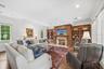 Living room with gas fireplace and custom wood work