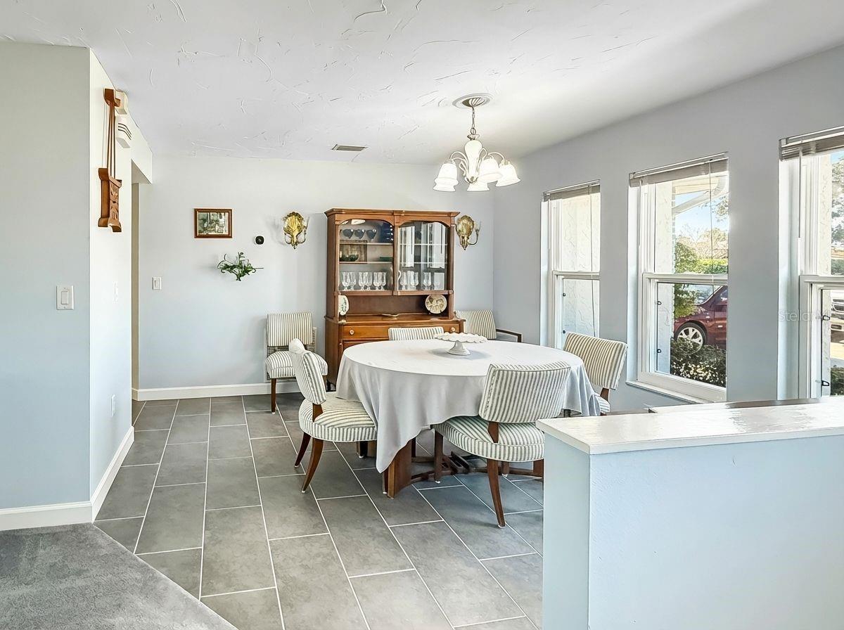 The dining room features porcelain tile for easy care. Impact-resistant windows let in lots of light!