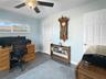Bedroom #3, porcelain tile, high new windows for light with privacy.