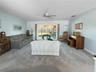 View from foyer into living room. Impact-resistant sliding doors