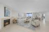 Virtually Staged - Living Room with electric fireplace and views of the water