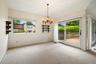 Formal dining room with Andersen slider out to backyard deck