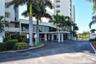 Entrance to the Whispering Sands beach through the tower buildings.