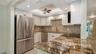 New 2025 kitchen with granite counters, stainless LG appliances, new soft close cabinetry & recessed lighting.
