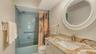 Updated guest bathroom with granite counters, new fixtures & soft close cabinetry.