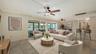 Virtually staged living and dining spaces.