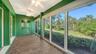 The enclosed lanai offers full 180 degree views of the shimmering lagoon.