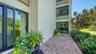 Private brick paver patio facing the lagoon is a unique feature of this unit.