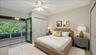 Virtually staged guest bedroom.