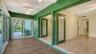 French doors open from both bedrooms into the enclosed lanai.