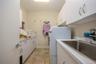 Utility sink and plenty of cabinets