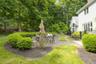 Stone patio  surrounding manicured shrubs