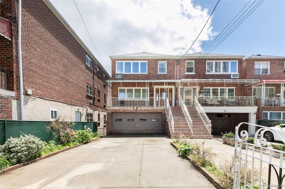 Two car garage with wide driveway up to four cars