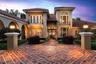 When the sunsets the home is illuminated by warm and inviting lighting coming from the residence and landscaping. It is all designed to welcome you ho