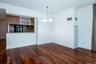 Dining area featuring a chandelier and dark wood finished floors