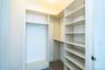 Spacious closet with carpet floors
