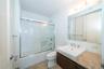 Hall Bathroom with vanity and enclosed tub / shower combo