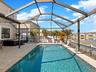 Covered Lanai overlooking pool and pond
