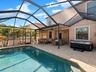 Covered Lanai overlooking pool and pond