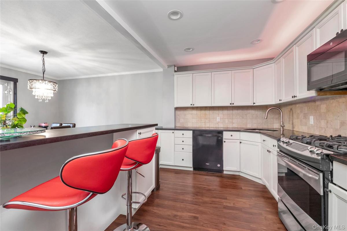 Stainless Steel appliances and breakfast bar