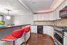 Stainless Steel appliances and breakfast bar